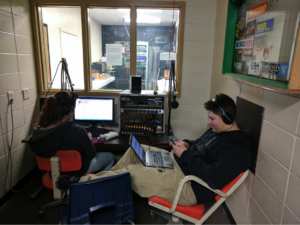 Rita Stubbs and Dan Lopes at work during one of their Monday radio broadcasts.